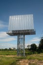 Blank billboard on the background of the road and blue sky. Royalty Free Stock Photo