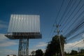 Blank billboard on the background of the road and blue sky. Royalty Free Stock Photo