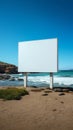 Blank billboard on the beach with sea in the background Royalty Free Stock Photo
