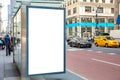 Blank billboard at bus stop for advertising, New York city buildings and street background Royalty Free Stock Photo