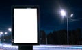 Blank billboard on a busy highway with traffic, neon lights Royalty Free Stock Photo