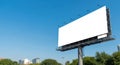 Blank billboard displaying advertisement space against a clear blue sky Royalty Free Stock Photo