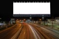 Blank billboard and light on highway road in night time. Royalty Free Stock Photo