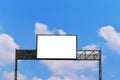 Blank billboard mockup with white screen against clouds and blue sky background. Royalty Free Stock Photo