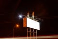 Blank billboard on night city street, mock up Royalty Free Stock Photo
