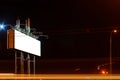 Blank billboard on night city street, mock up Royalty Free Stock Photo