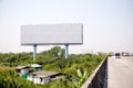 Blank billboard on the sideway in the park.