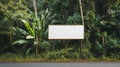 Blank Billboard Sign in a Lush Tropical Forest Royalty Free Stock Photo