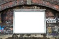 Blank billboard on weathered brick wall