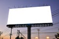 Blank billboard with white screen against blue sky at twilight time background. Copy space banner for advertisement. Royalty Free Stock Photo