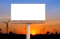 Blank billboard with wind turbine at sunset time for advertisem Royalty Free Stock Photo