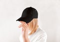 Blank black baseball cap mockup template, wear on women head Royalty Free Stock Photo