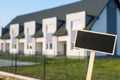 Blank Black billboard against apartment family house Empty mockup template Blackboard label at Townhome. Copy space