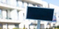 Blank Black billboard against new apartment building Empty mockup template Blackboard label Home for rent. Apartments