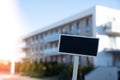 Blank Black billboard against new apartment building Empty mockup template Blackboard label Home for rent. Apartments