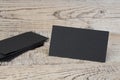 Blank Black business cards on the wooden table. Template for ID. Top view