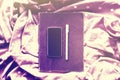 Blank black cell phone screen with diary and pen on scarf with d Royalty Free Stock Photo