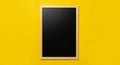 Blank Black Chalkboard with Light Wood Frame on Bright Yellow Background blackboard empty Royalty Free Stock Photo
