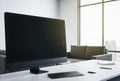 Blank black computer screen on designer desktop