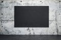 Blank black concrete poster on loft concrete wall in empty room Royalty Free Stock Photo