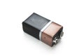 Blank black and copper 9v battery on white background