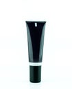 Blank black cream tube or cosmetic bottle isolated on white background Royalty Free Stock Photo