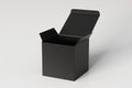Blank black cube gift box with opened hinged flap lid on white background. Clipping path around box mock up.