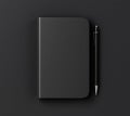 Blank black diary cover and pen on black table Royalty Free Stock Photo