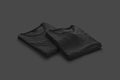 Blank black folded square t-shirt mockup pair, dark background