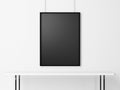 Blank black frame under white table. 3d render