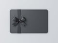 Blank black gift business card with black ribbon bow on white grey background with shadow minimal concept 3D rendering Royalty Free Stock Photo