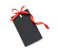 Blank black gift tag with red satin ribbon on white background, top view. Space for design Royalty Free Stock Photo