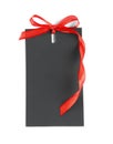 Blank black gift tag with red satin ribbon on white background, top view. Space for design Royalty Free Stock Photo