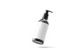 Blank black glass pump bottle with white label mockup