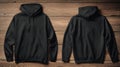 Blank Black Hoodie Mockup, Front and Back, Dark Wood Background Royalty Free Stock Photo