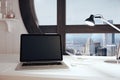 Blank black laptop screen in modern room with round window window and lamp, mock up