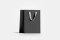 Blank black paper gift bag with white silk handle mockup, Royalty Free Stock Photo