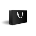 Blank black paper shopping bag or gift bag with ribbon handles mockup template. Isolated on white background with shadow. Royalty Free Stock Photo