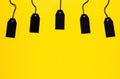 Blank black price tags on yellow background