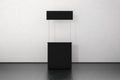 Blank black promo counter mockup stand near the wall