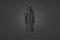 Blank black protective raincoat mockup on dark background