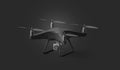 Blank black quadcopter mockup, stand isolated on dark background