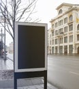 Blank black rectangular pylon stand on street mockup, side view