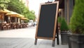 Blank black restaurant shop sign or menu board near the entrance of street cafe at day, neural network generated image Royalty Free Stock Photo