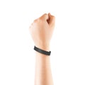Blank black rubber wristband mockup on hand, isolated Royalty Free Stock Photo
