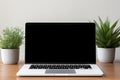 Blank black screen with laptop computer mockup isolated on office desk background Royalty Free Stock Photo