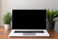 Blank black screen with laptop computer mockup isolated on office desk background Royalty Free Stock Photo