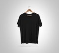 Blank black t-shirt front on hanger, design mockup, clipping path Royalty Free Stock Photo