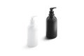 Blank black and white plastic soap bottle mockup stand isolated
