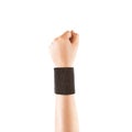 Blank black wristband mockup on hand, isolated